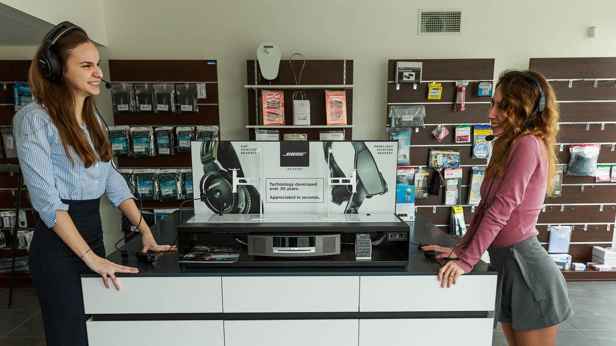 AIR TEAM showroom — customer support at the headset desk
